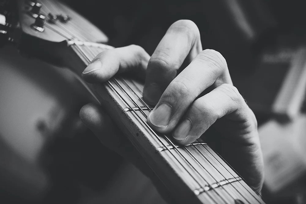 guitar and finger