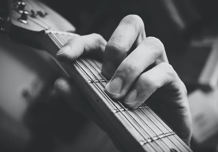 guitar and finger